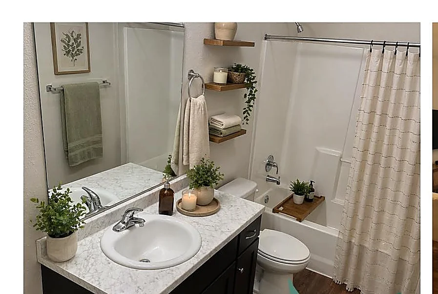 Bathroom with large vanity, ample counter space, and tile flooring